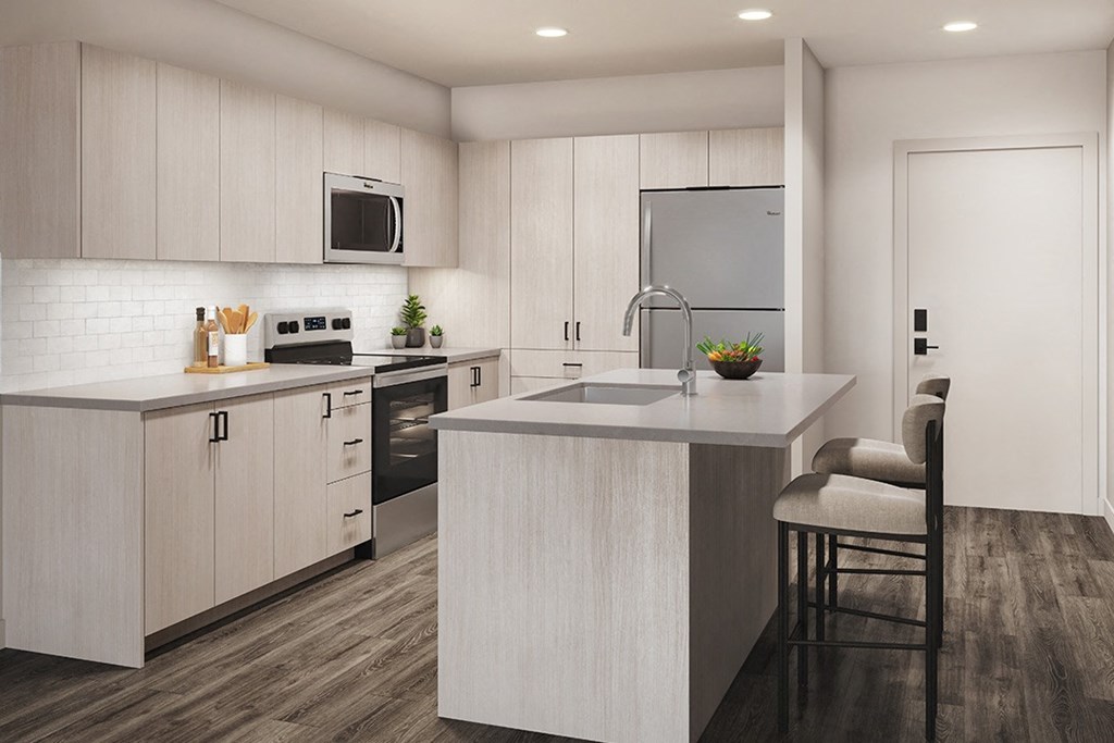 a kitchen with white cabinets and a counter top
